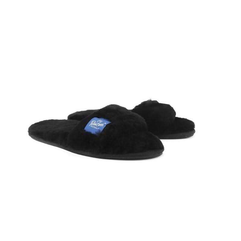 Black fluffy sheepskin slippers with wool lining, front three-quarter view. - Yellow Earth Australia