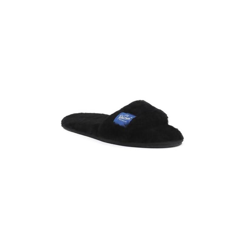 Black sheepskin slipper with fluffy wool lining, side view on white background. - Yellow Earth Australia