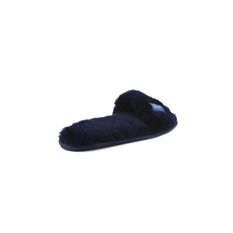 Navy blue sheepskin slipper with fluffy wool lining, side view on white background. - Yellow Earth Australia