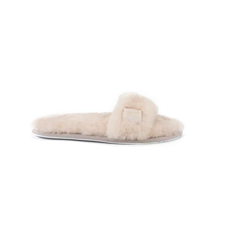 Cream sheepskin slider slipper with fluffy wool upper, side view. - Yellow Earth Australia