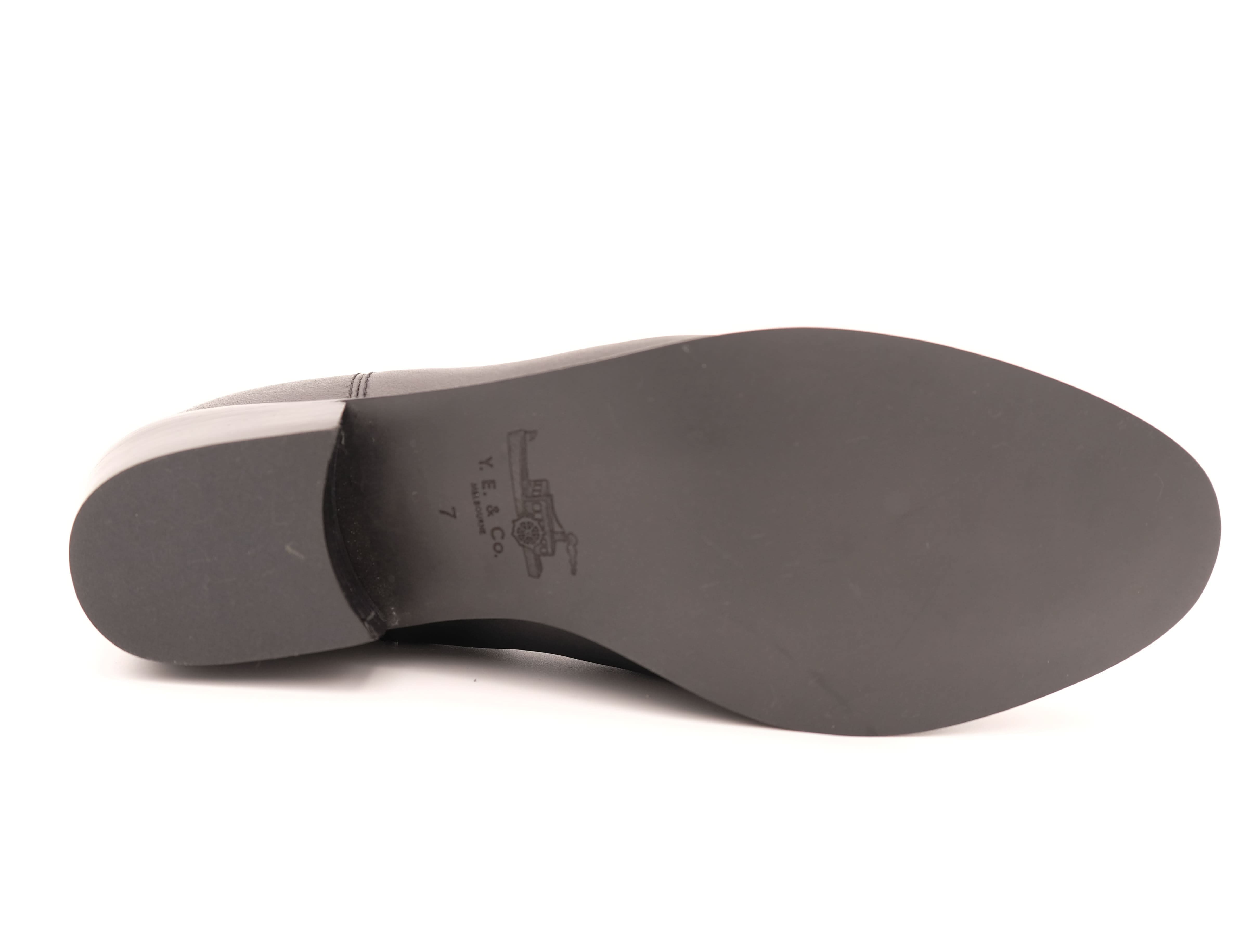 Grey leather boot sole with visible stitching, overhead view. - Yellow Earth Australia