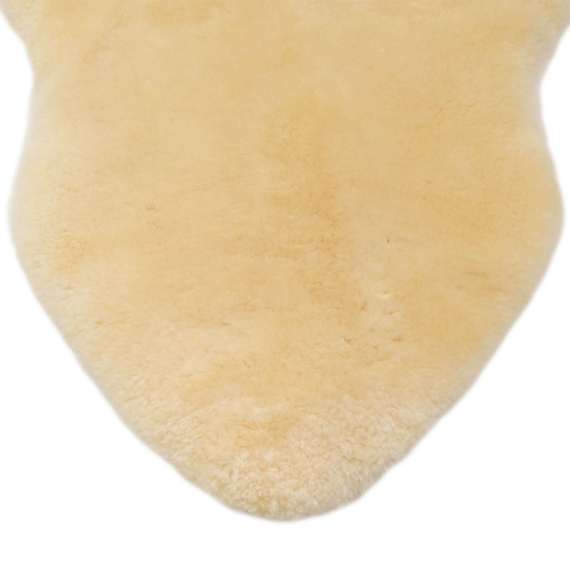 Cream sheepskin rug with soft wool pile viewed from above. - Yellow Earth Australia