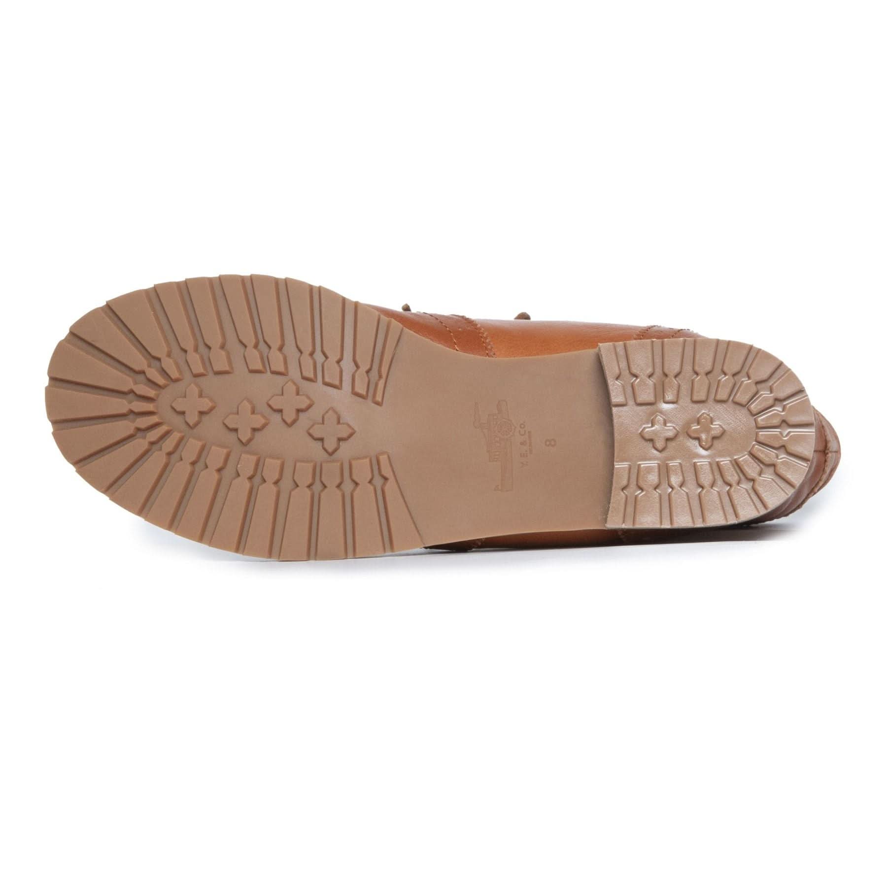 Tan leather sole of brown sheepskin boot shown from underneath angle. - Yellow Earth Australia
