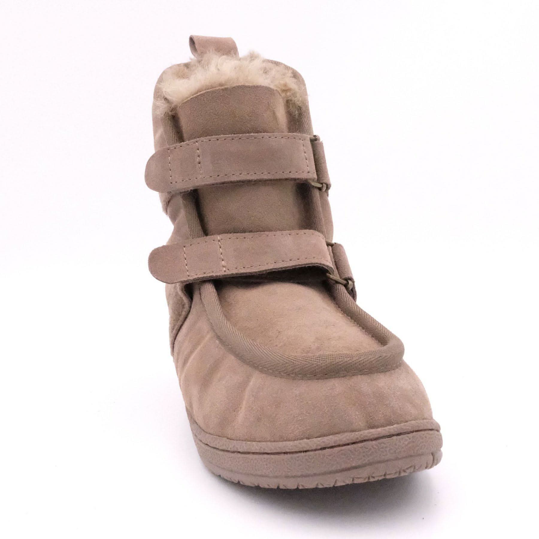 Beige sheepskin snow boot with dual velcro straps and wool lining, front view. - Yellow Earth Australia
