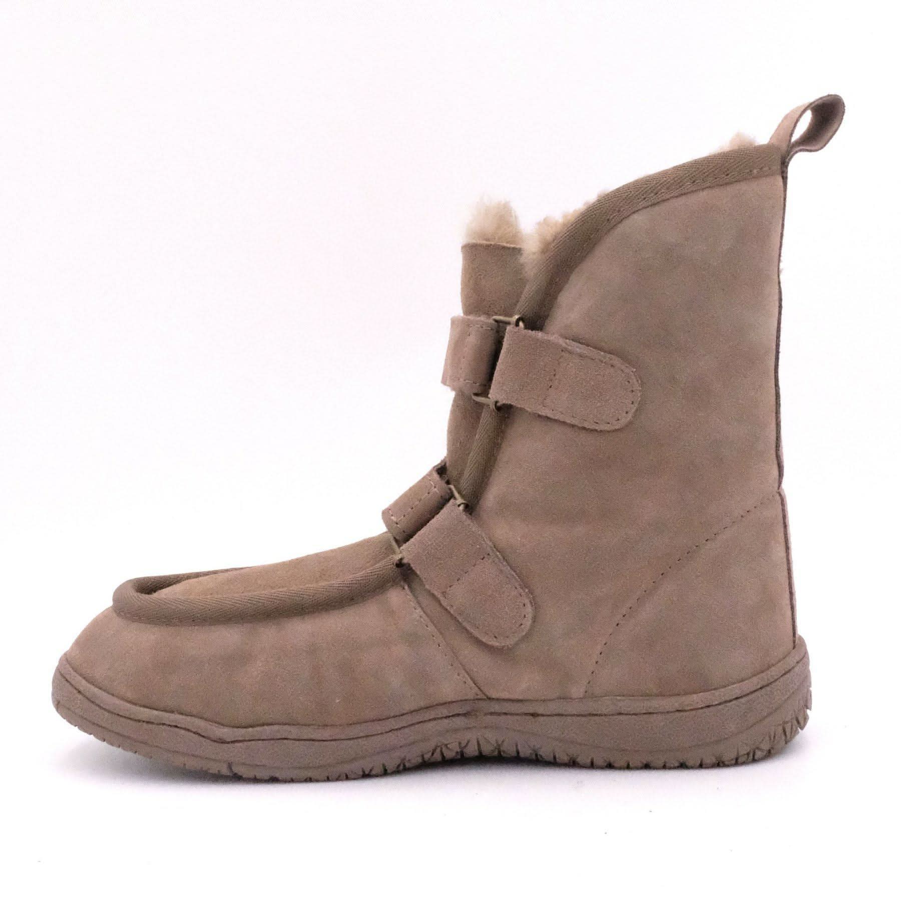 Beige sheepskin boot with wool lining, side view showing velcro straps and textured sole. - Yellow Earth Australia