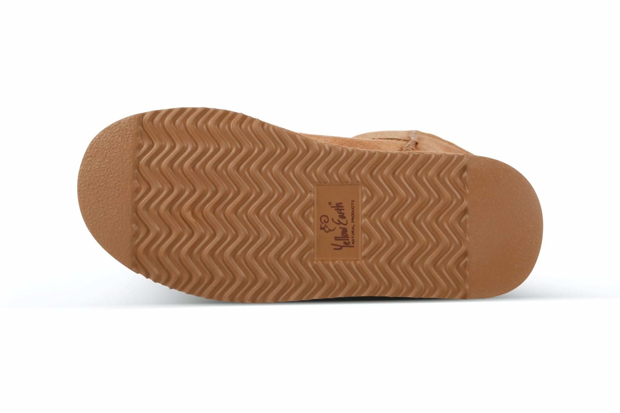 Tan sheepskin slipper sole with wavy tread pattern, bottom view. - Yellow Earth Australia