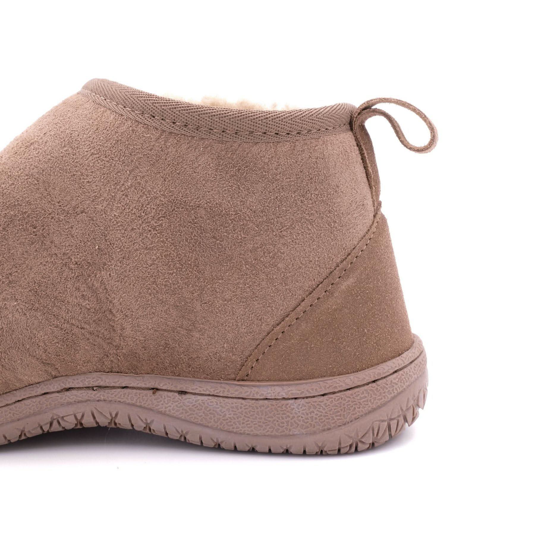 Taupe sheepskin slipper boot with wool lining, side view showing textured sole and pull tab. - Yellow Earth Australia