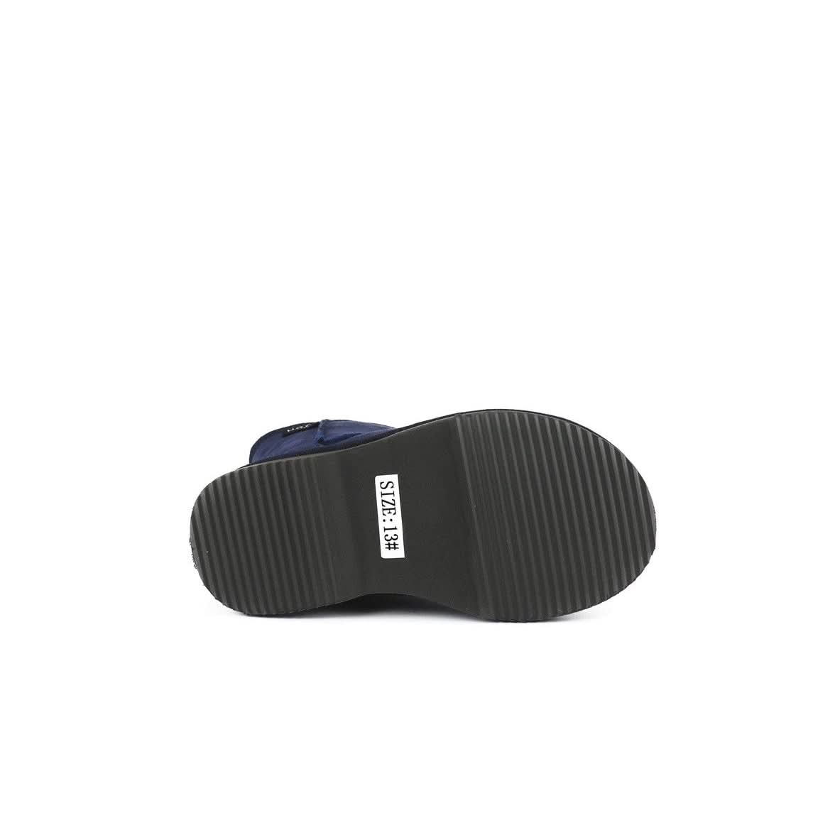 Navy blue sheepskin bootie sole view showing dark ribbed rubber outsole with size label. - Yellow Earth Australia