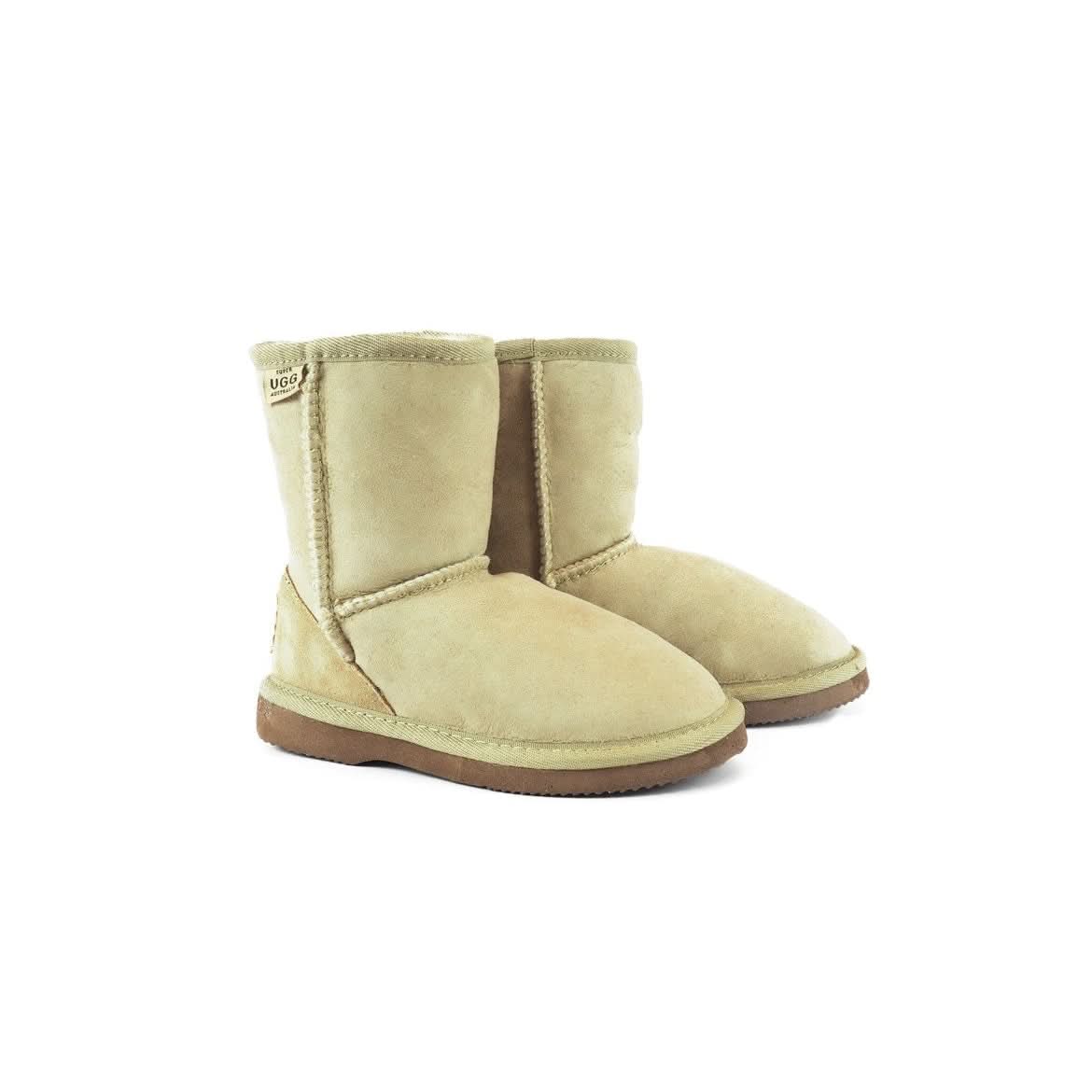 Pair of cream sheepskin boots with brown soles displayed front-facing. - Yellow Earth Australia