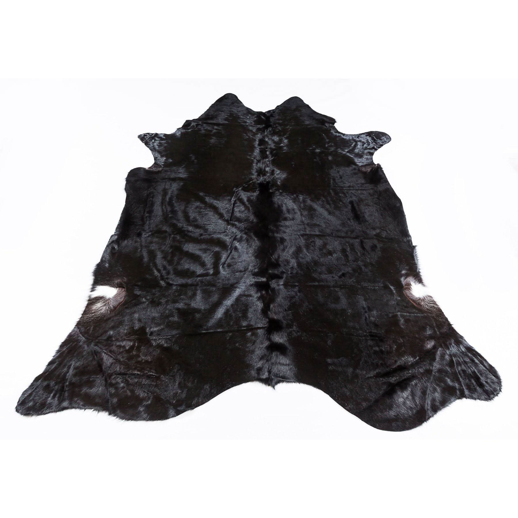 Black genuine cowhide rug with natural fur texture, displayed flat from above. - Yellow Earth Australia