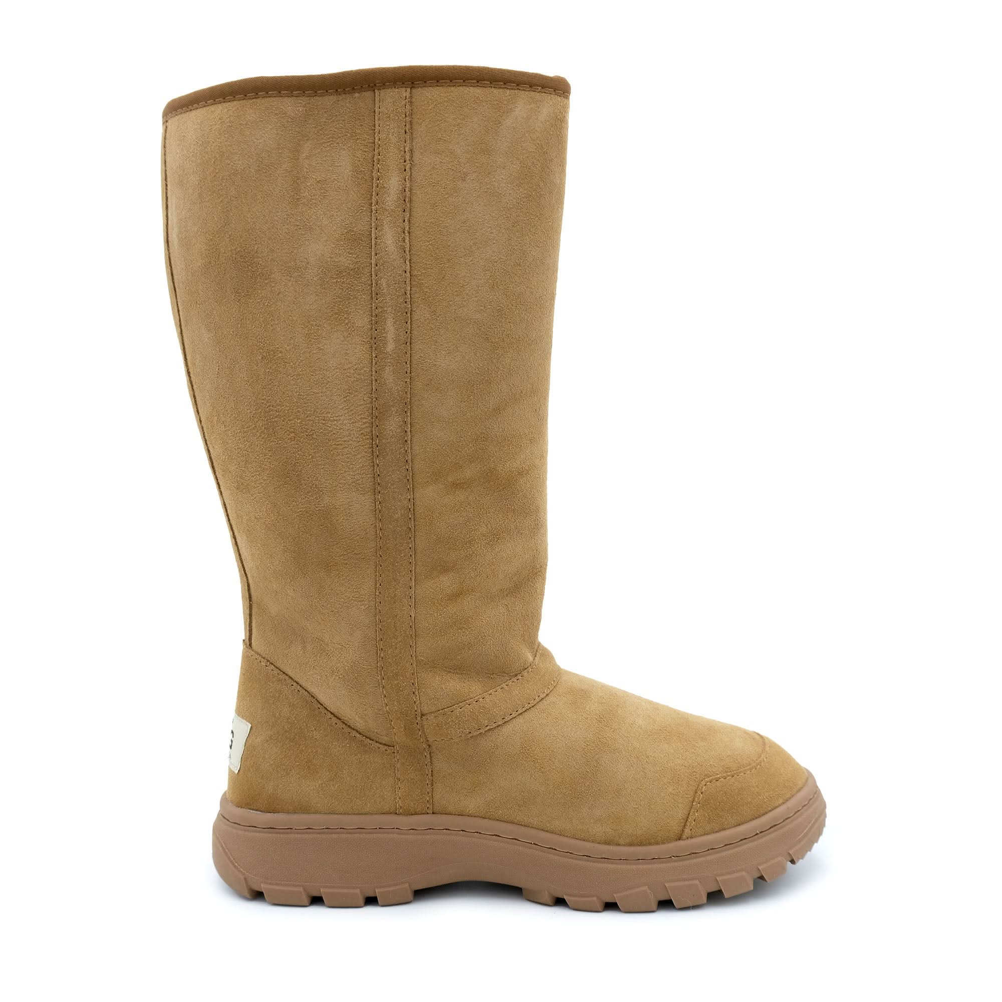 Tall chestnut suede sheepskin boot with chunky tread sole, side view. - Yellow Earth Australia