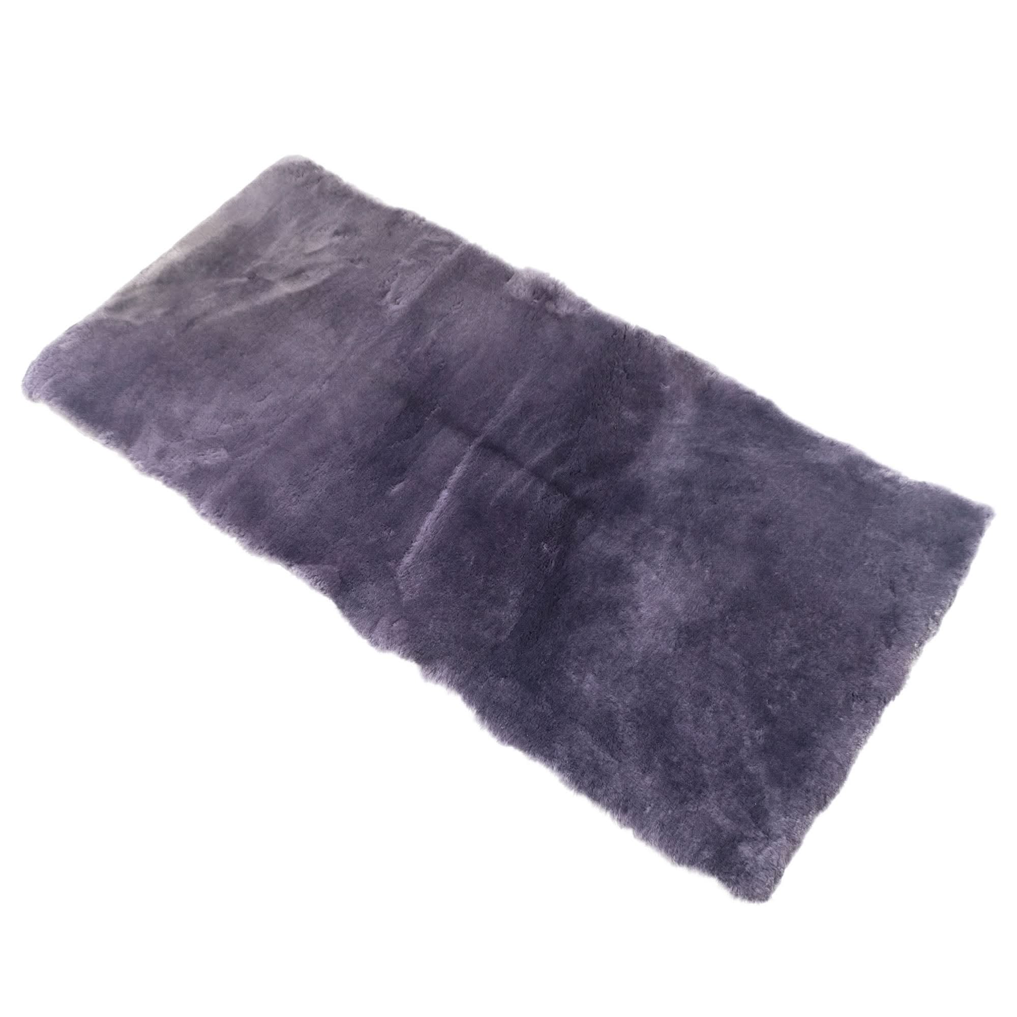 Grey sheepskin rug with soft wool pile viewed from above on white background. - Yellow Earth Australia