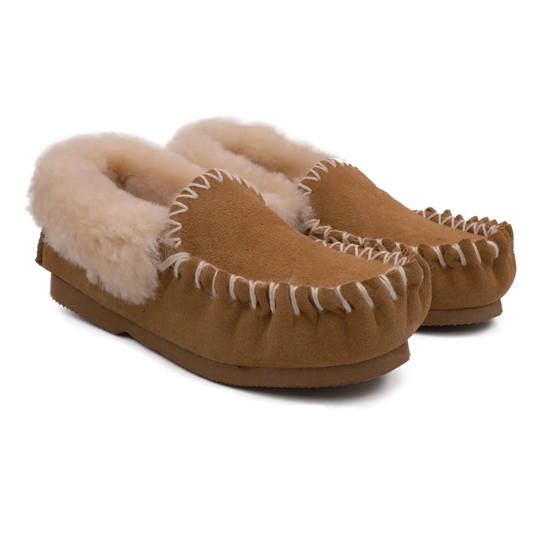 Tan suede moccasin slippers with cream sheepskin lining, angled front view. - Yellow Earth Australia