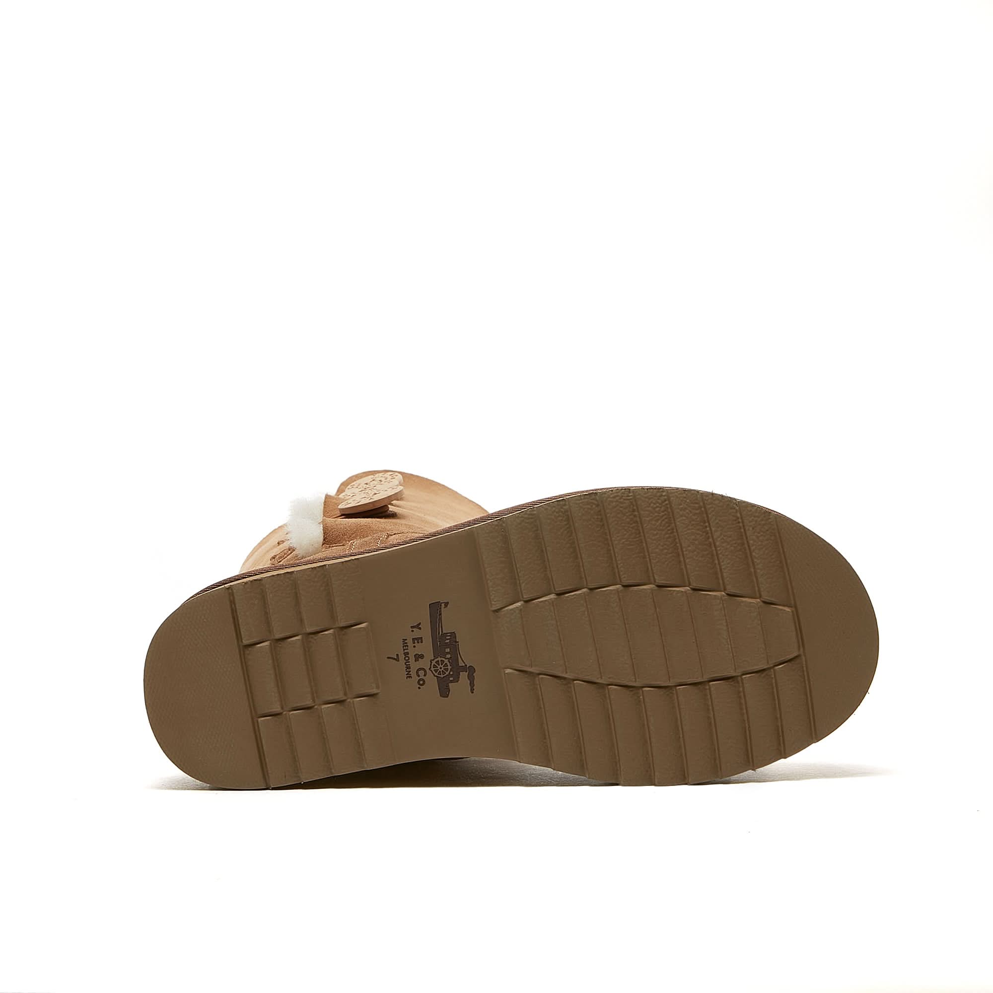 Tan suede sheepskin boot with cream wool lining, sole view displayed. - Yellow Earth Australia