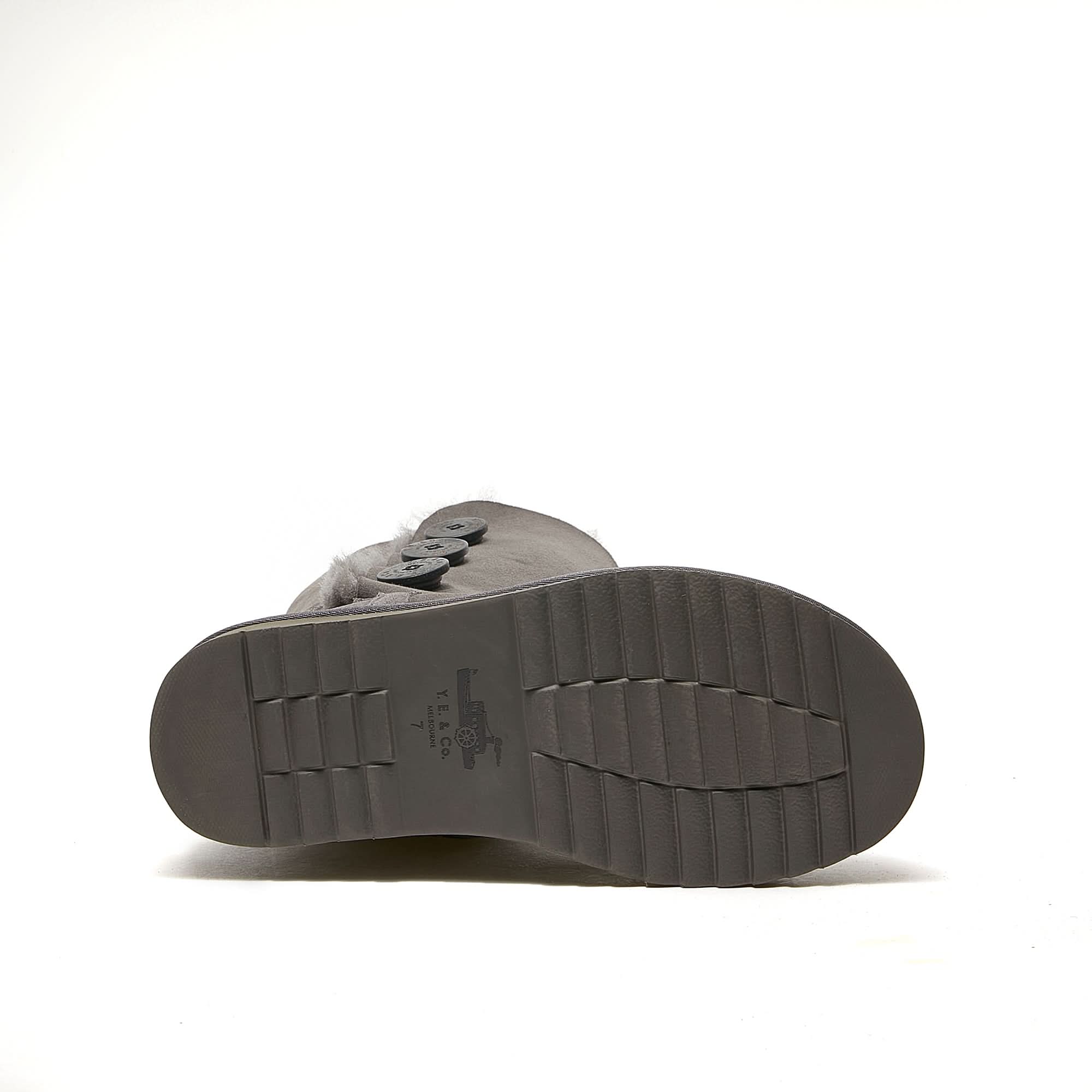 Grey sheepskin boots with wool lining shown from sole view angle. - Yellow Earth Australia