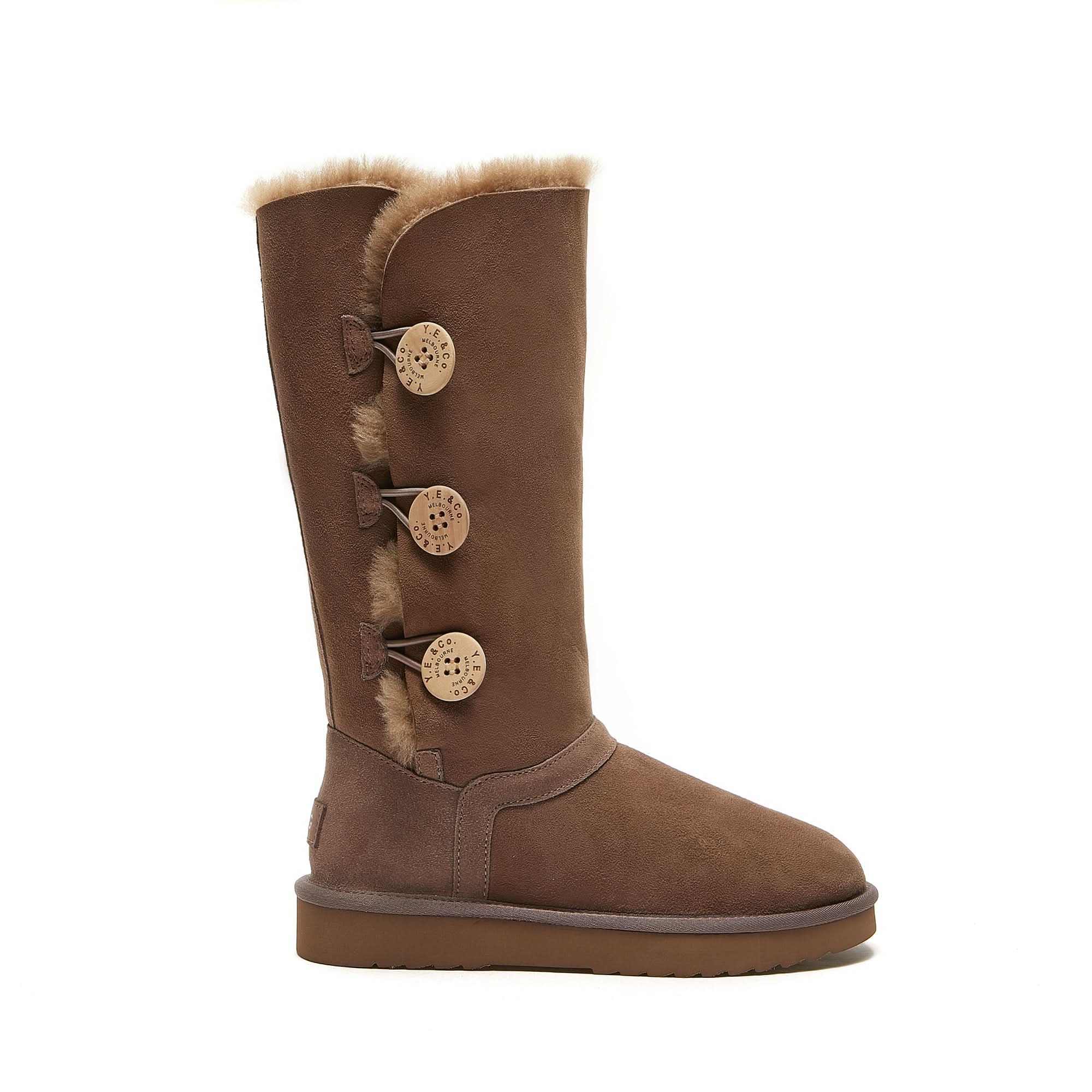 Tall brown sheepskin boot with three decorative buttons and fluffy wool lining, side view. - Yellow Earth Australia