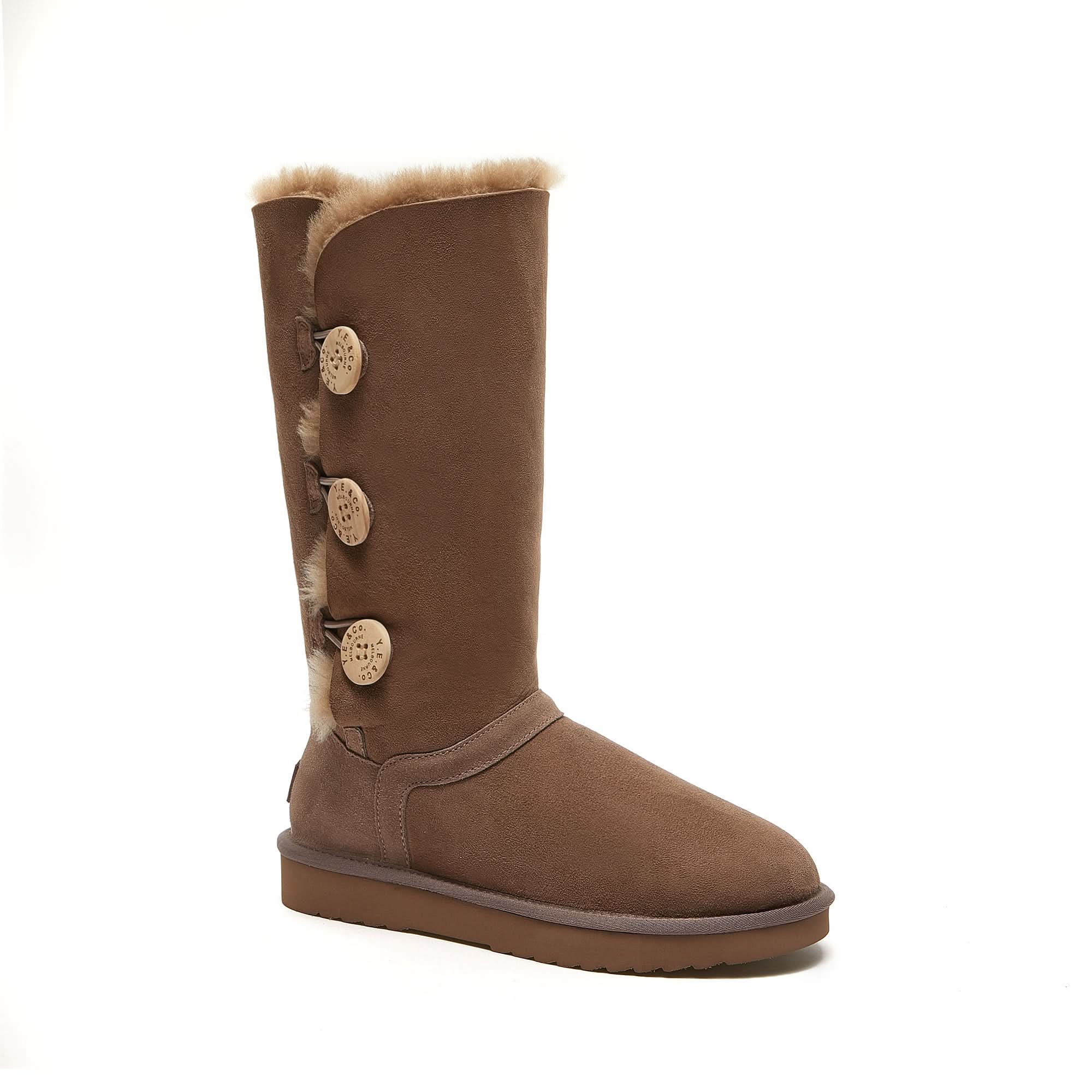 Tall brown sheepskin boot with three decorative buttons and fluffy wool lining, side view. - Yellow Earth Australia