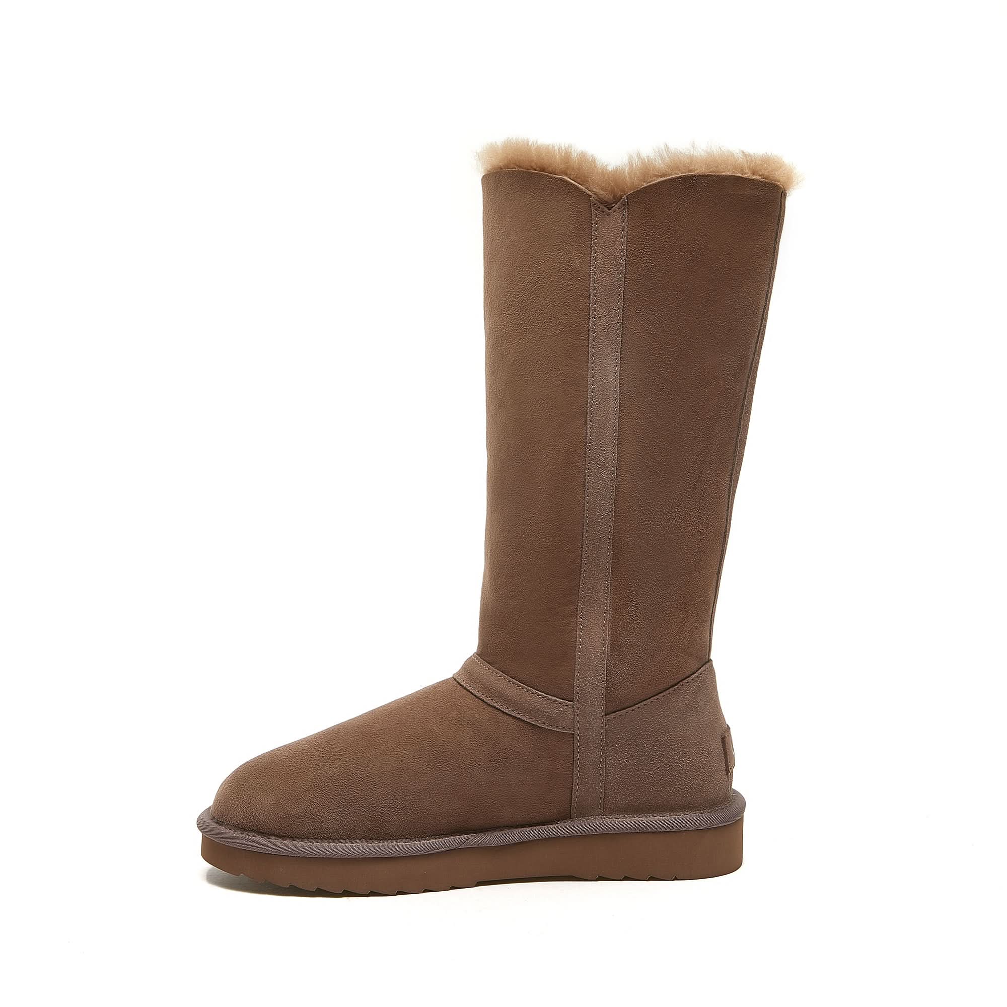 Classic tall brown sheepskin boot with plush wool lining, side view on white background