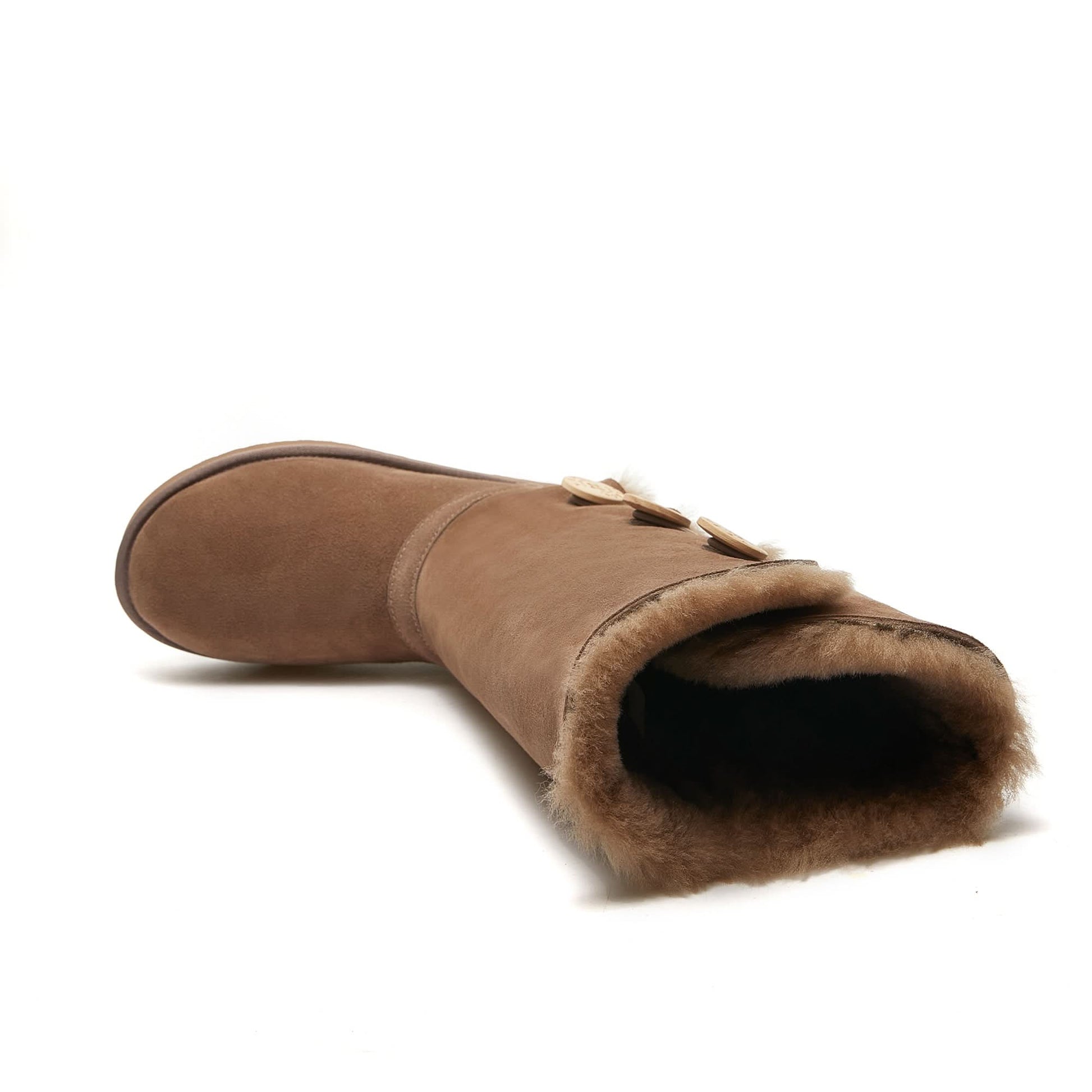 Brown sheepskin UGG boot with button details and plush wool lining, side view