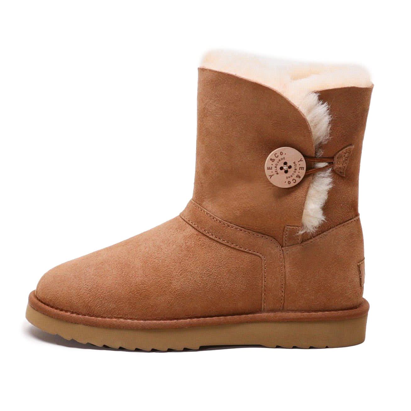 Chestnut sheepskin boot with wool lining and decorative button, side view. - Yellow Earth Australia