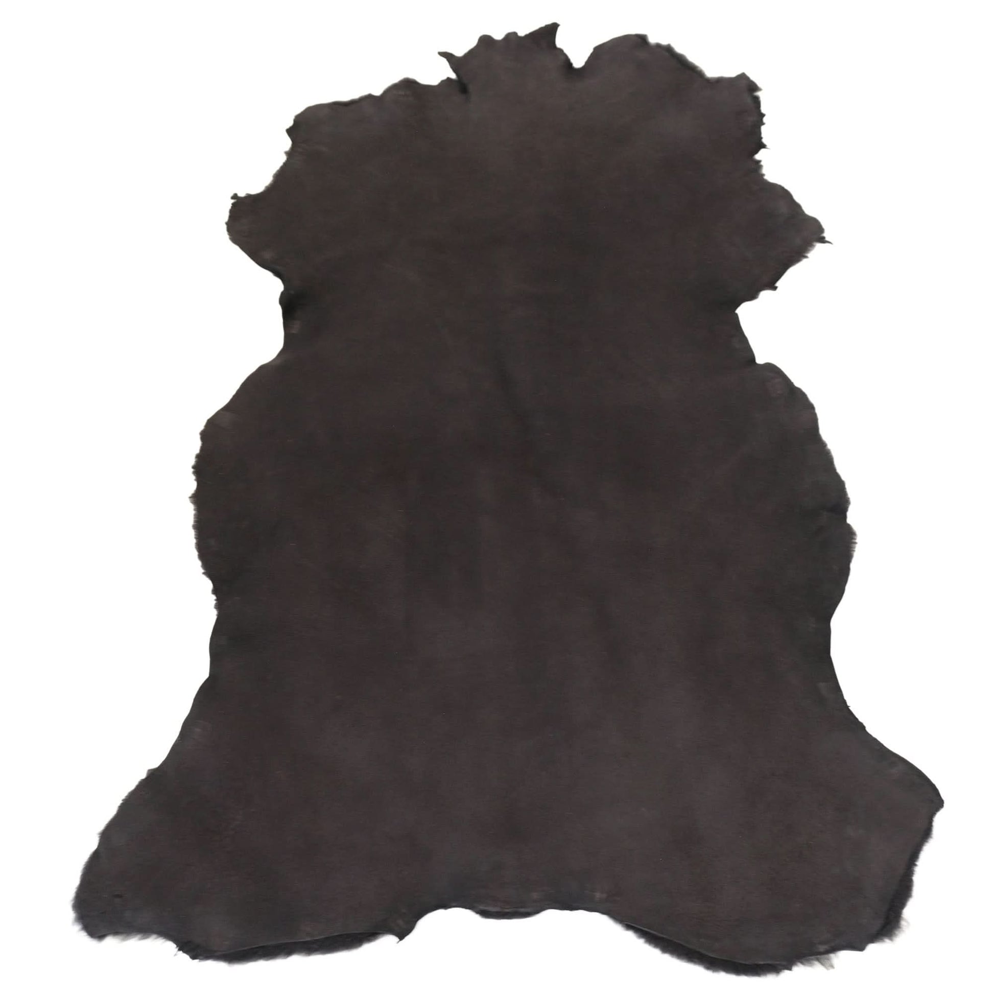 Black sheepskin rug with natural wool texture, full hide view. - Yellow Earth Australia