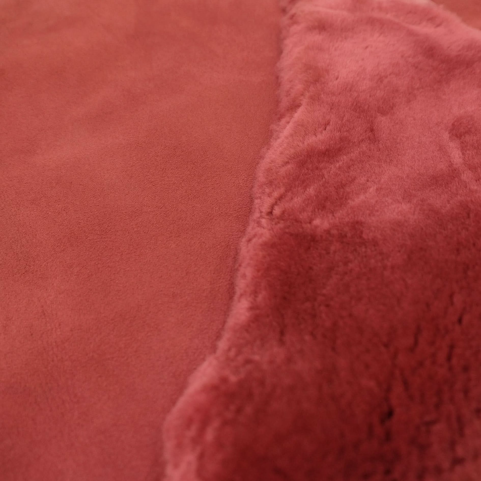 Dusty rose sheepskin with soft woolly texture shown in close-up detail view. - Yellow Earth Australia