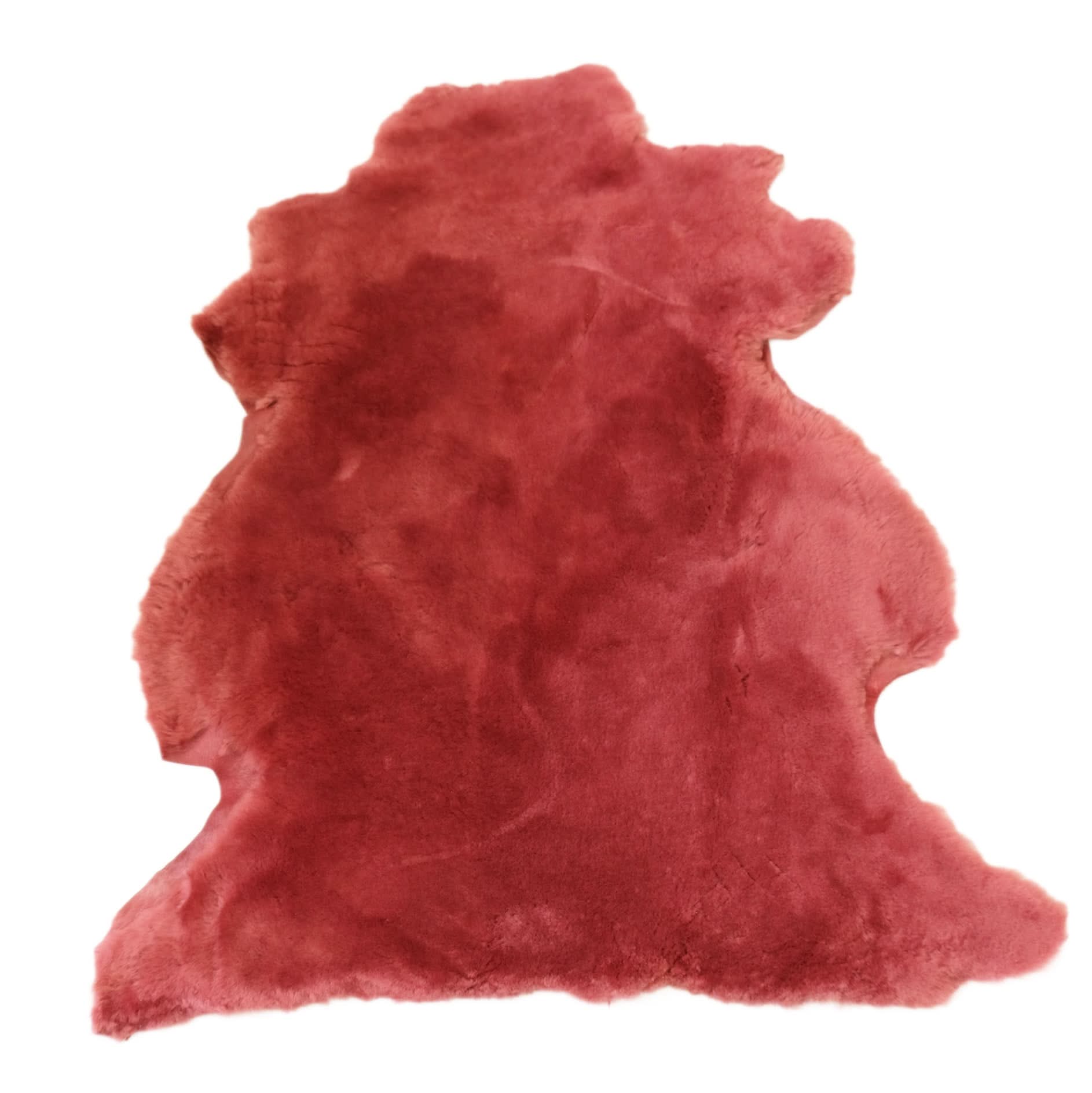 Red sheepskin rug with soft wool texture, viewed from above on white background. - Yellow Earth Australia