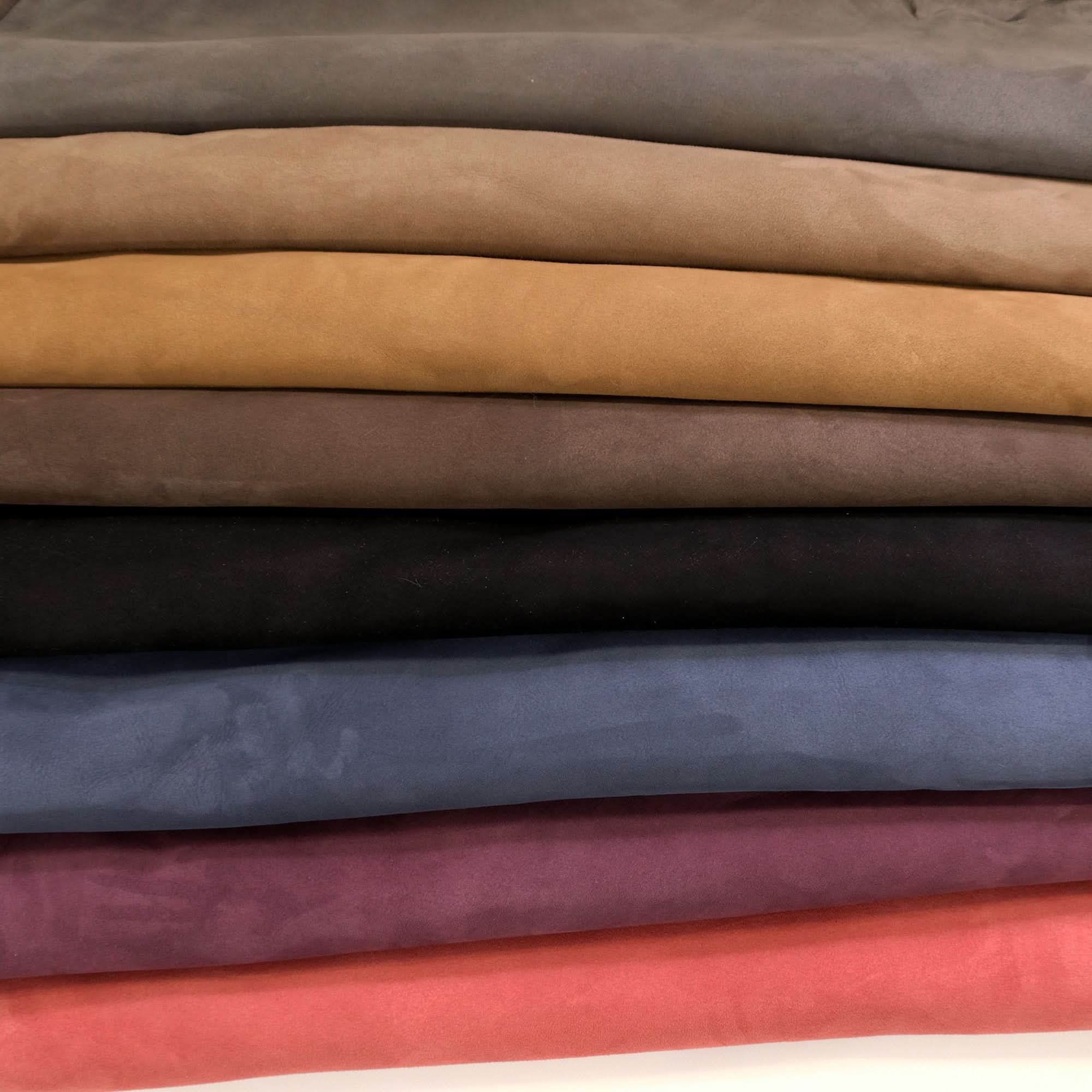 Stacked suede fabric swatches in neutral and warm tones showing color options. - Yellow Earth Australia