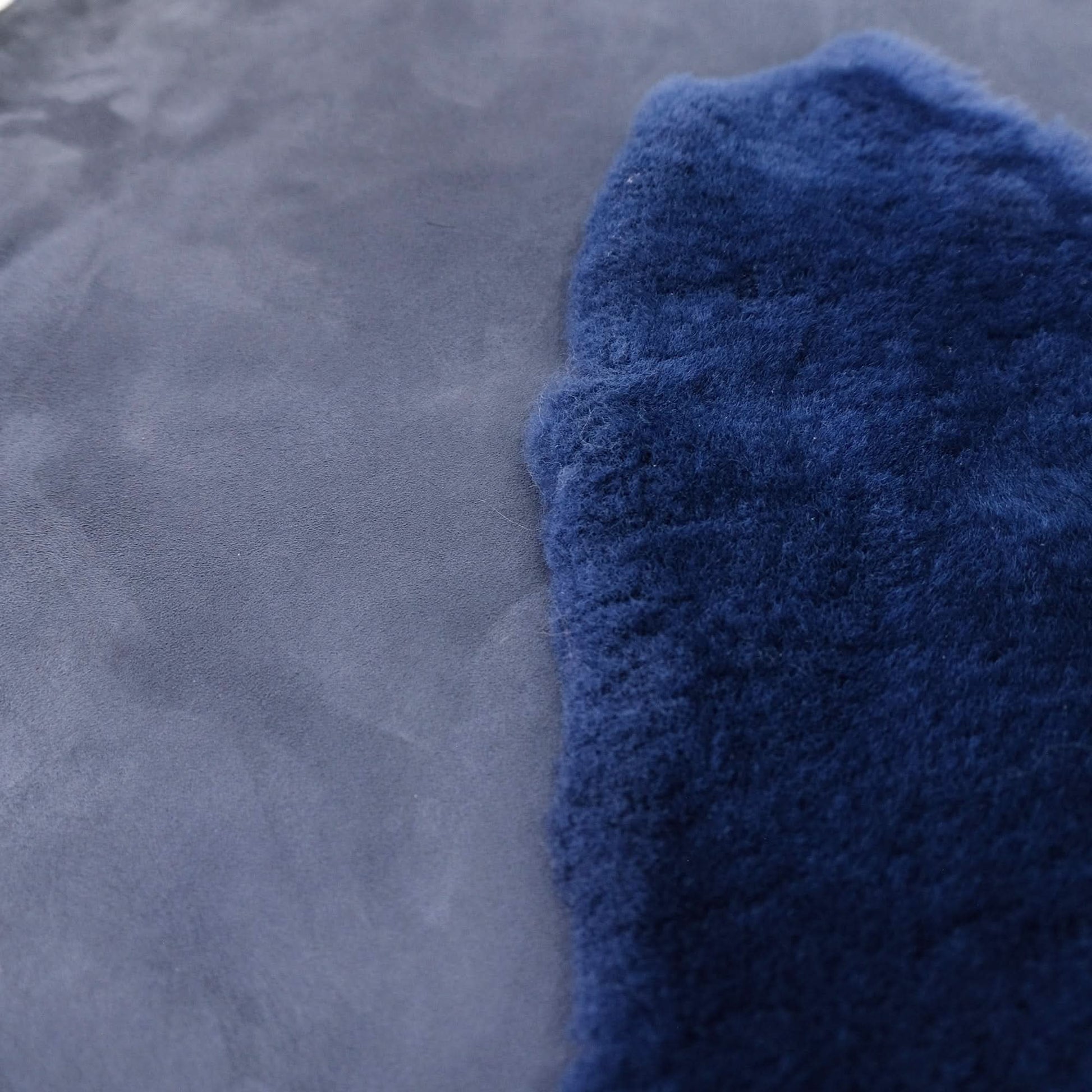 Blue sheepskin rug showing soft wool pile texture and smooth suede backing. - Yellow Earth Australia