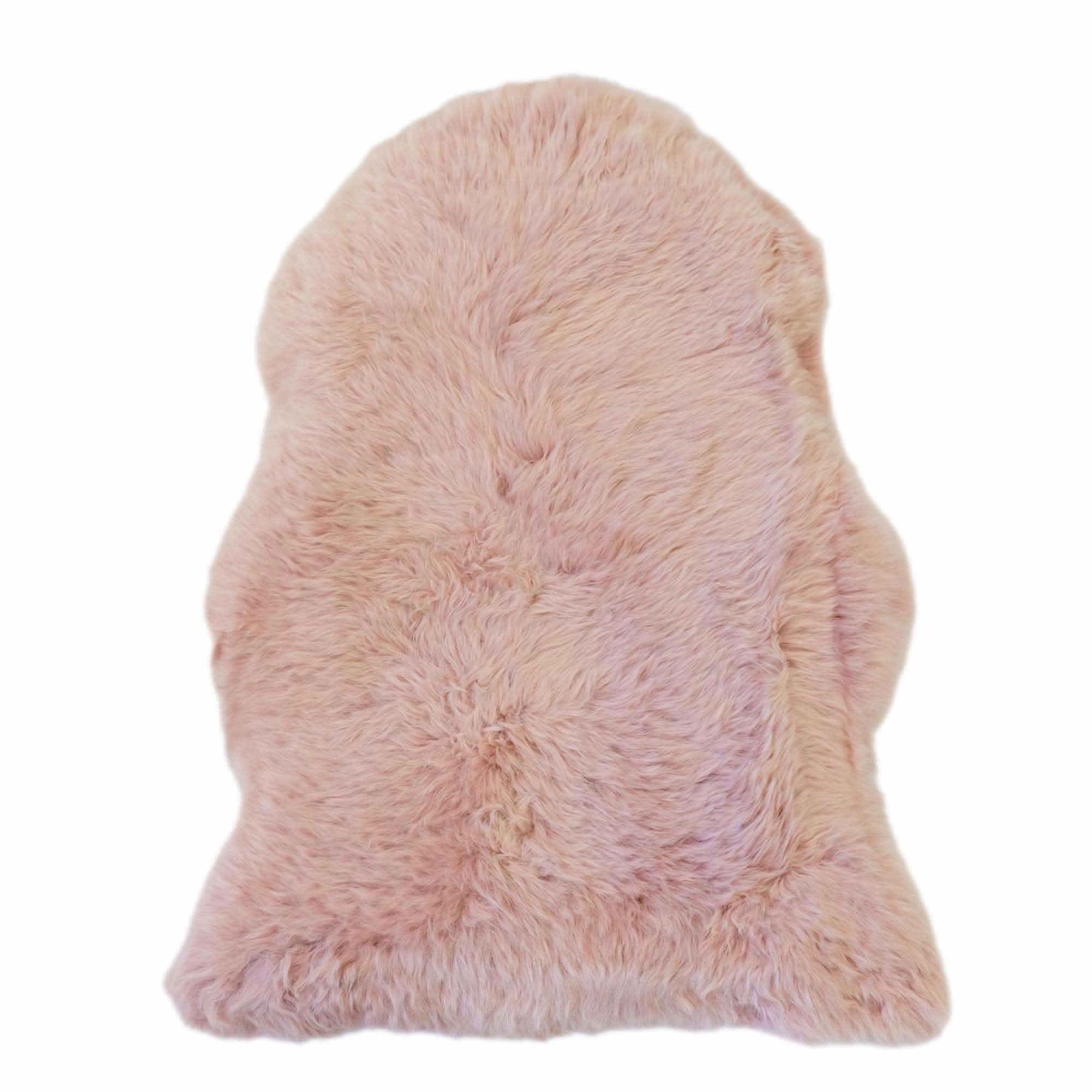 Blush pink sheepskin rug with soft wool fleece, viewed from above. - Yellow Earth Australia