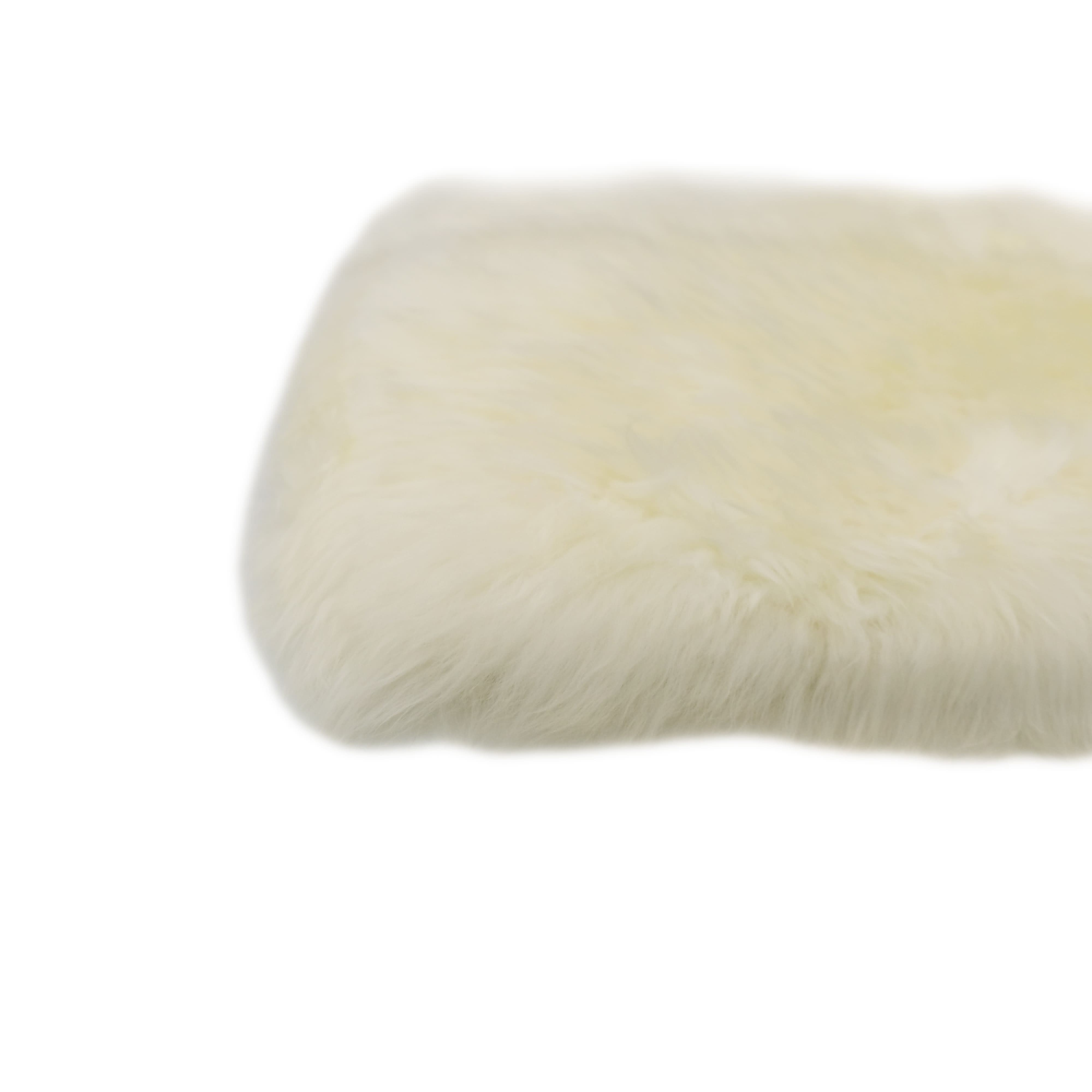 Cream sheepskin cushion cover shown from side angle displaying soft wool texture. - Yellow Earth Australia
