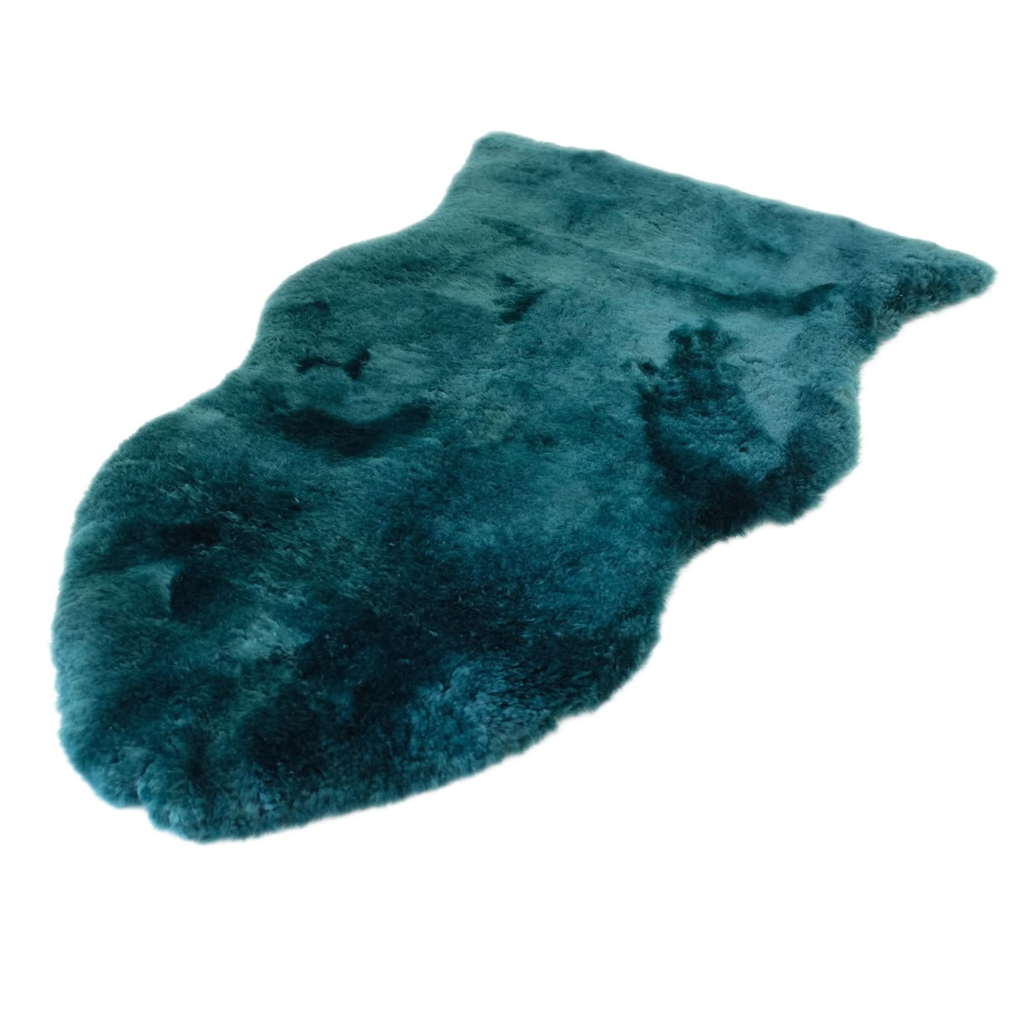 Teal sheepskin rug with luxurious wool texture, top-down angled view. - Yellow Earth Australia