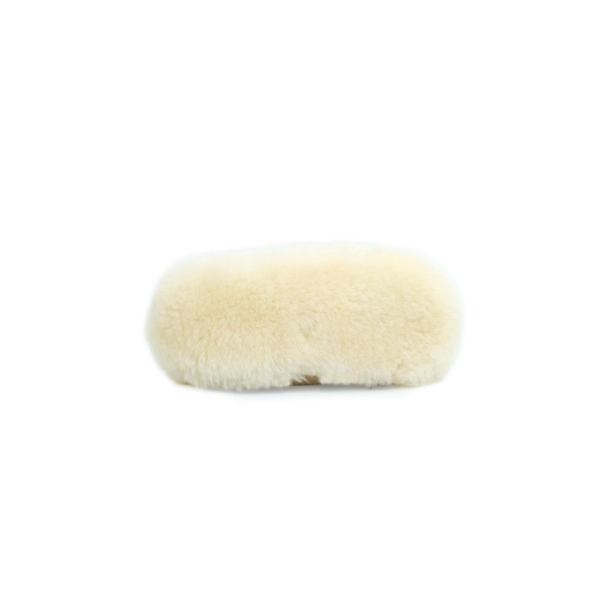Cream sheepskin oval cushion viewed from above showing soft wool texture. - Yellow Earth Australia