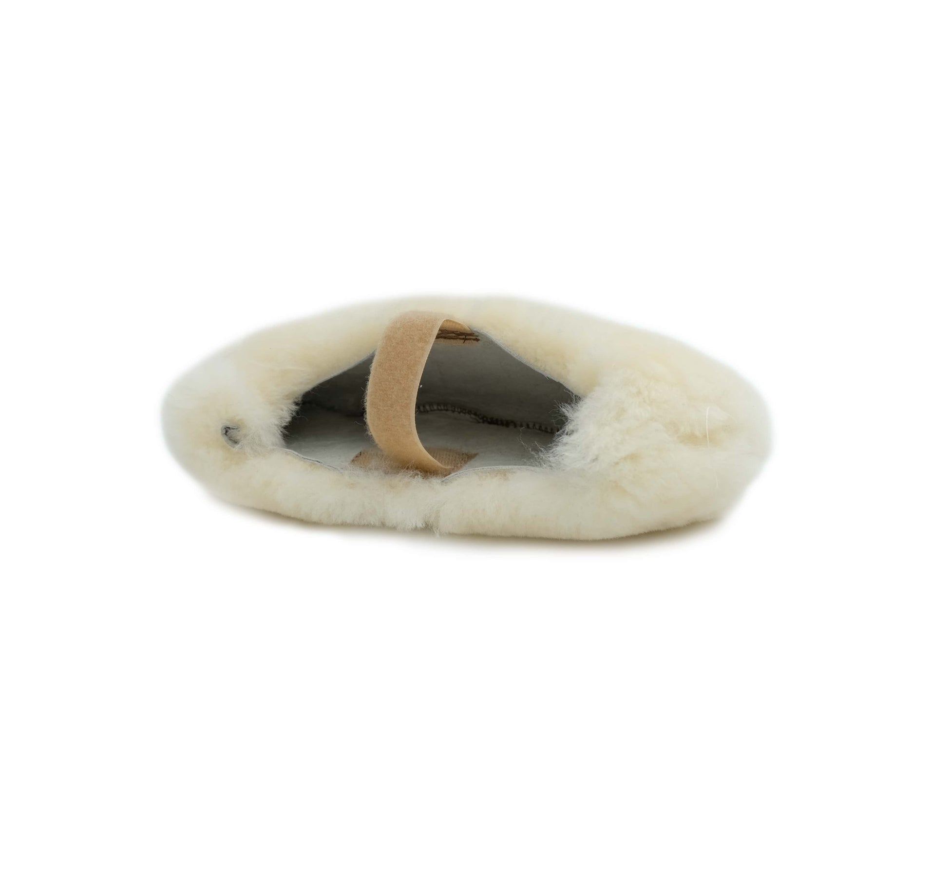 Cream sheepskin cat bed with tan leather handle, top view on white background. - Yellow Earth Australia