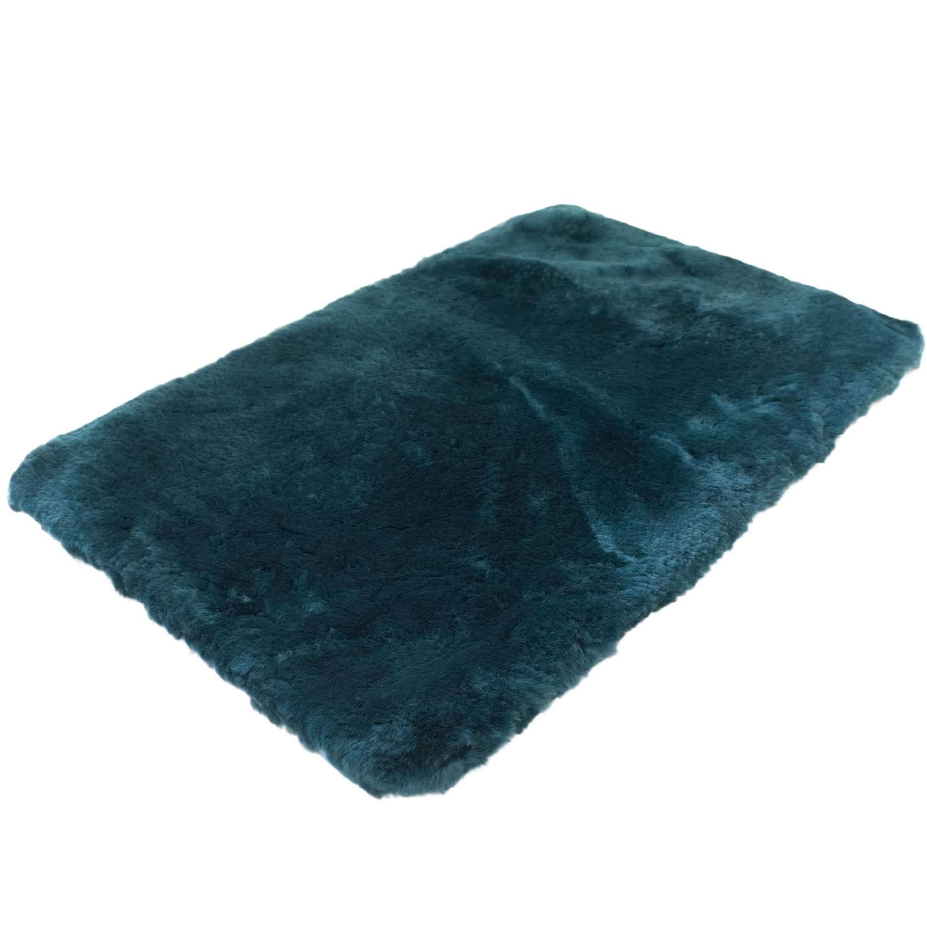 Teal sheepskin rug with thick wool pile viewed from above at an angle. - Yellow Earth Australia