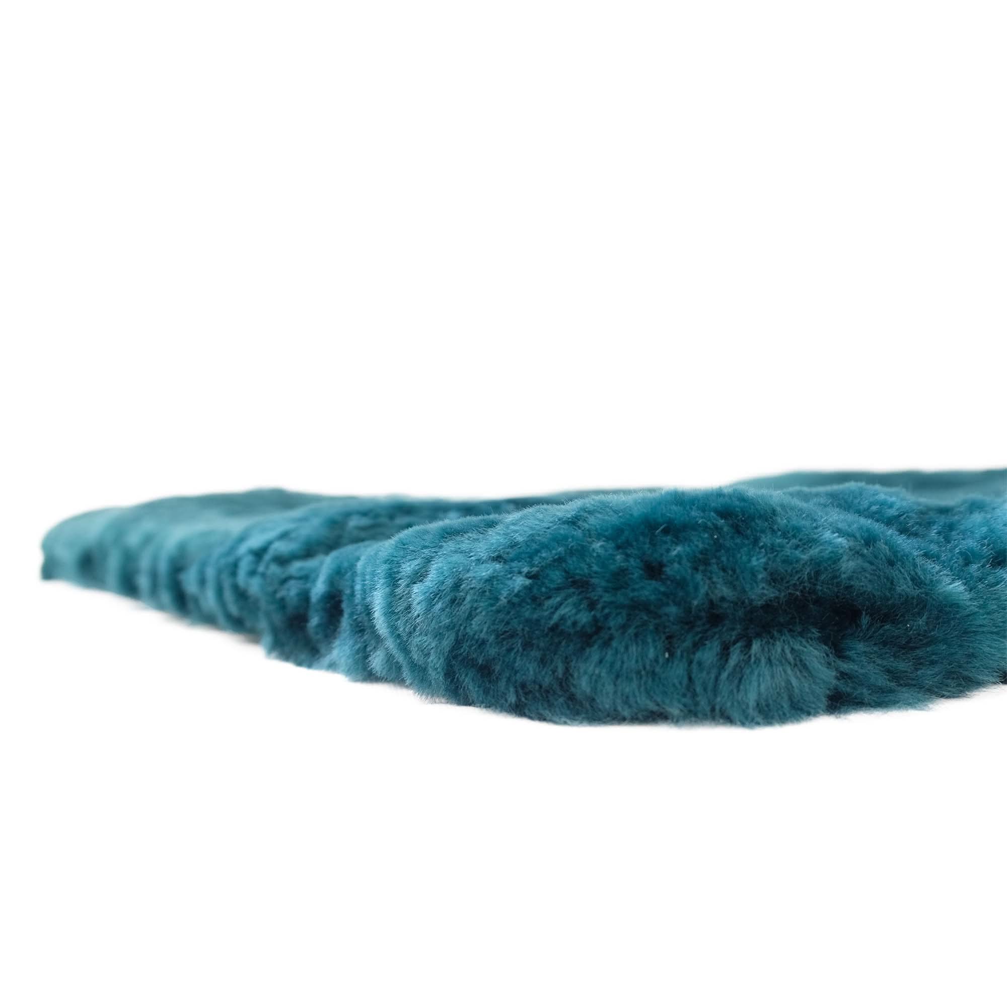 Teal sheepskin wool product shown from side angle displaying soft, fluffy texture. - Yellow Earth Australia