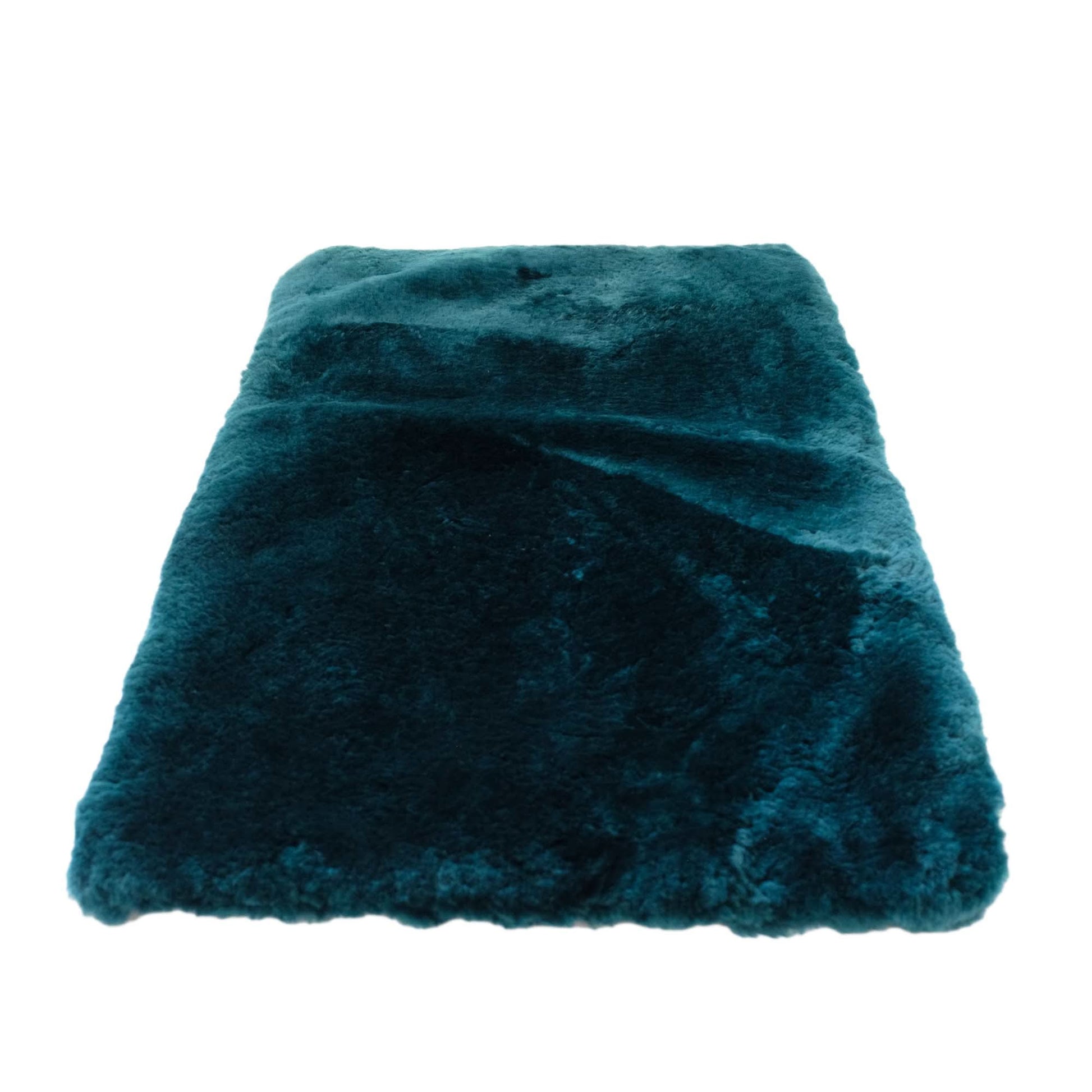 Teal sheepskin throw blanket with luxurious wool texture, folded view. - Yellow Earth Australia