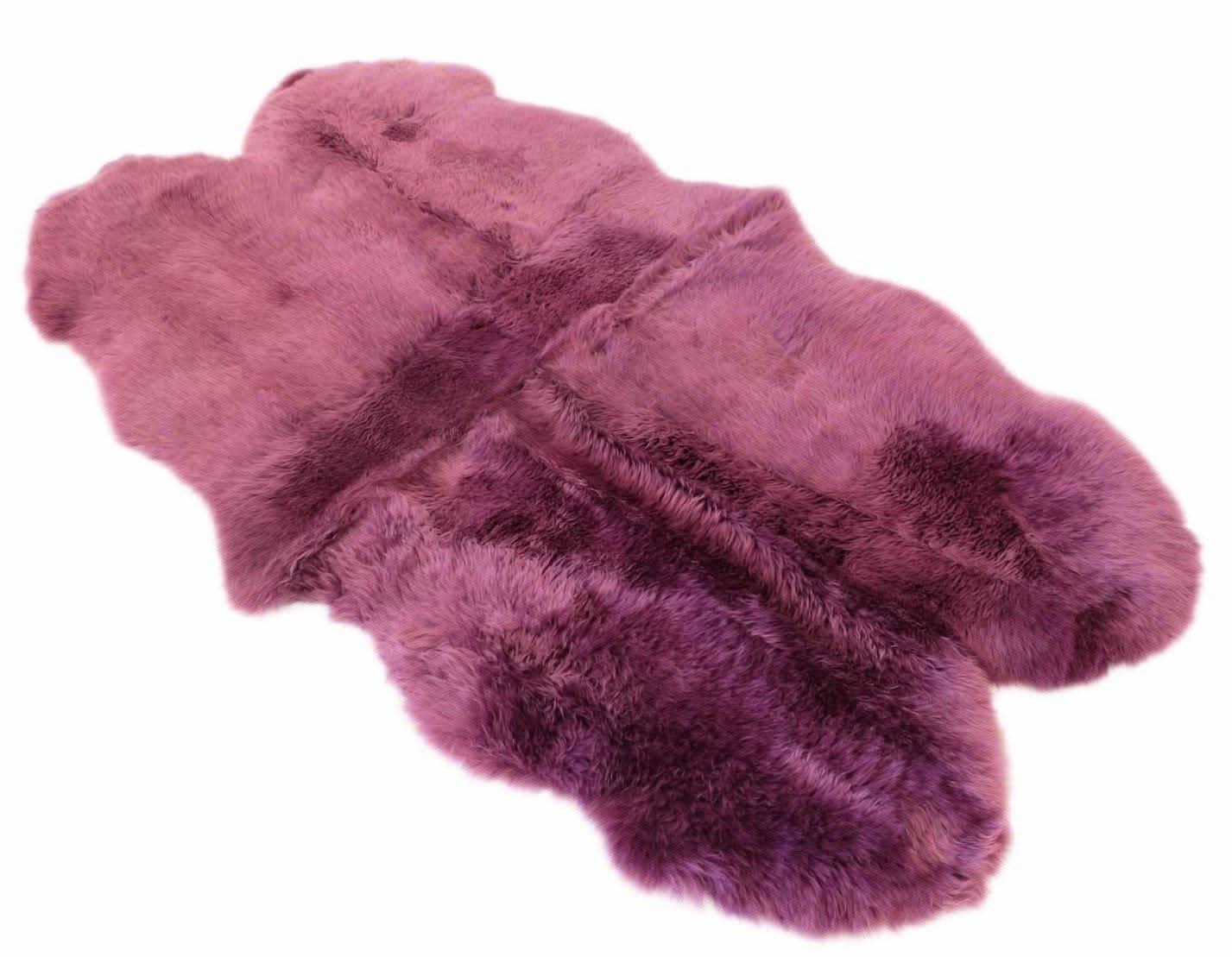 Pink sheepskin rug with luxurious wool texture viewed from above. - Yellow Earth Australia