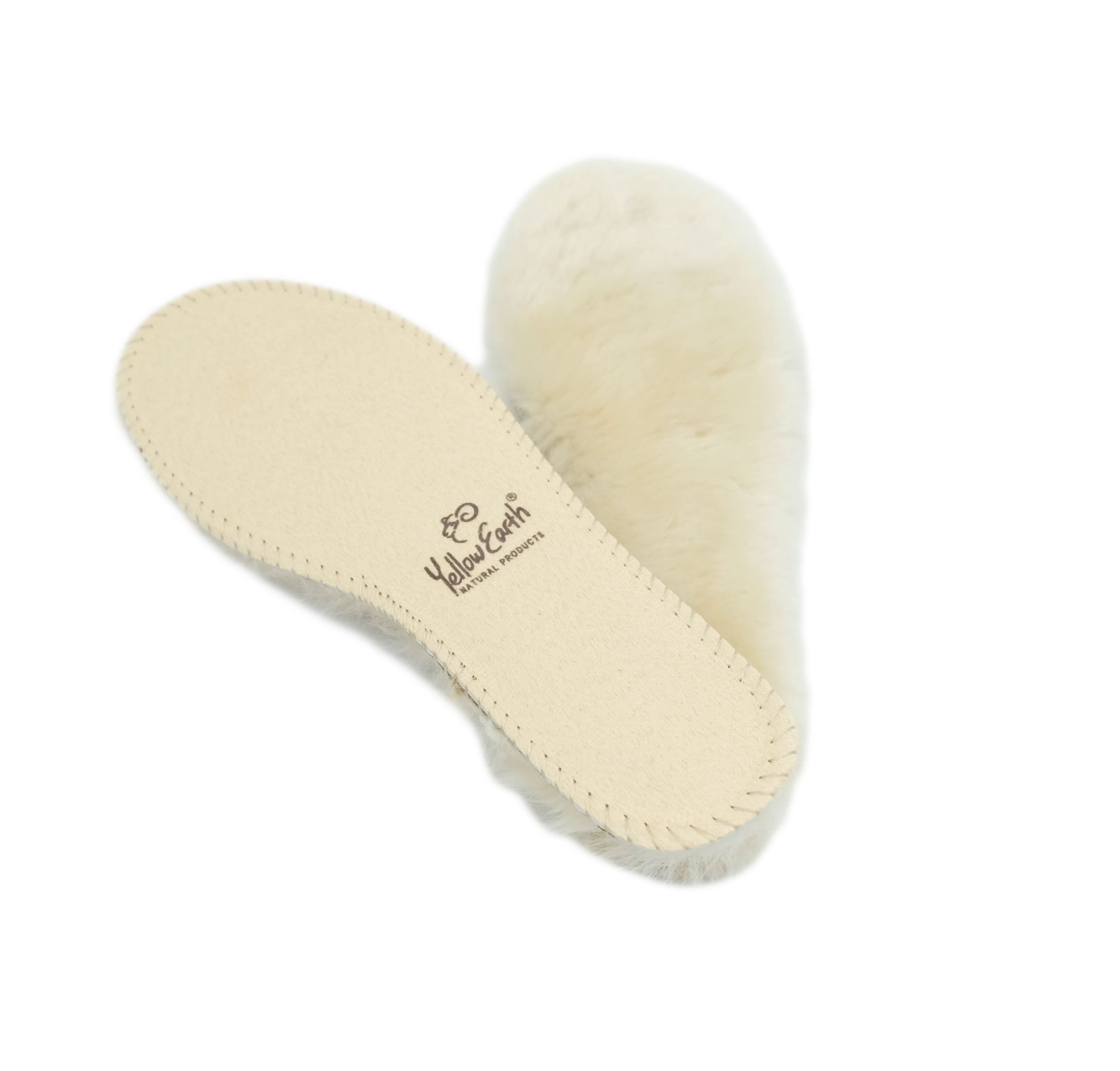 Cream sheepskin slippers with wool lining, top view showing sole and fluffy upper. - Yellow Earth Australia