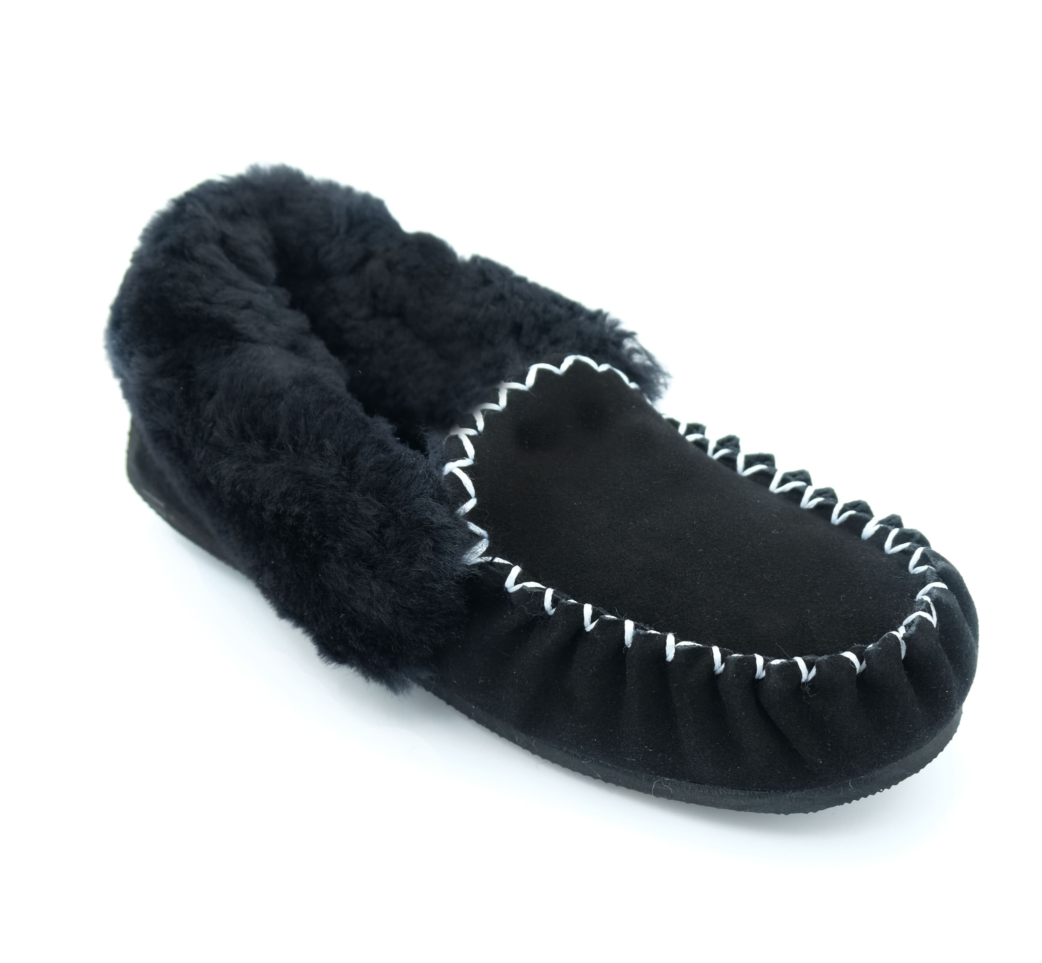 Black sheepskin moccasin slipper with fur lining, angled side view. - Yellow Earth Australia