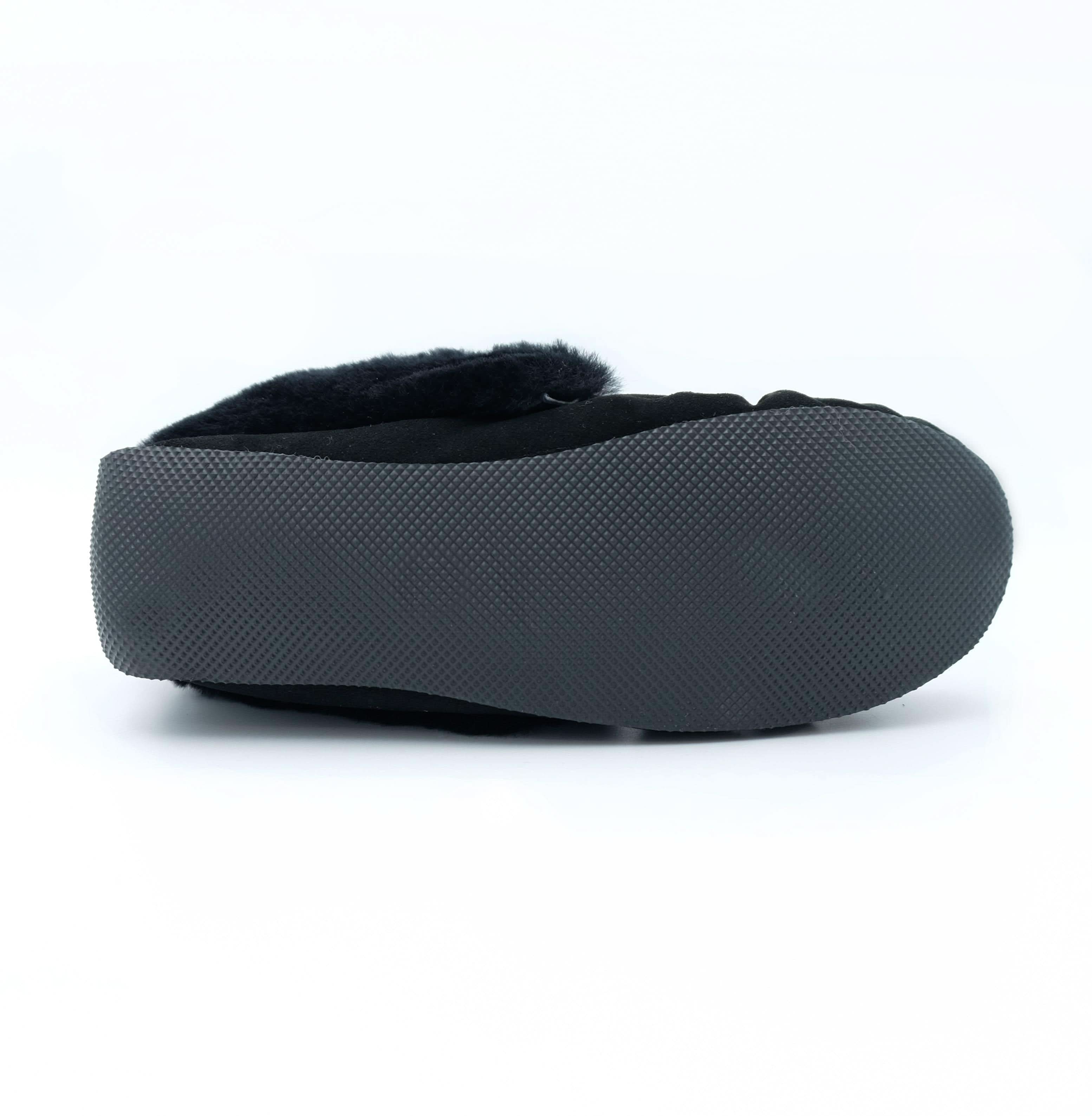 Black sheepskin slipper with grey textured sole, side view. - Yellow Earth Australia