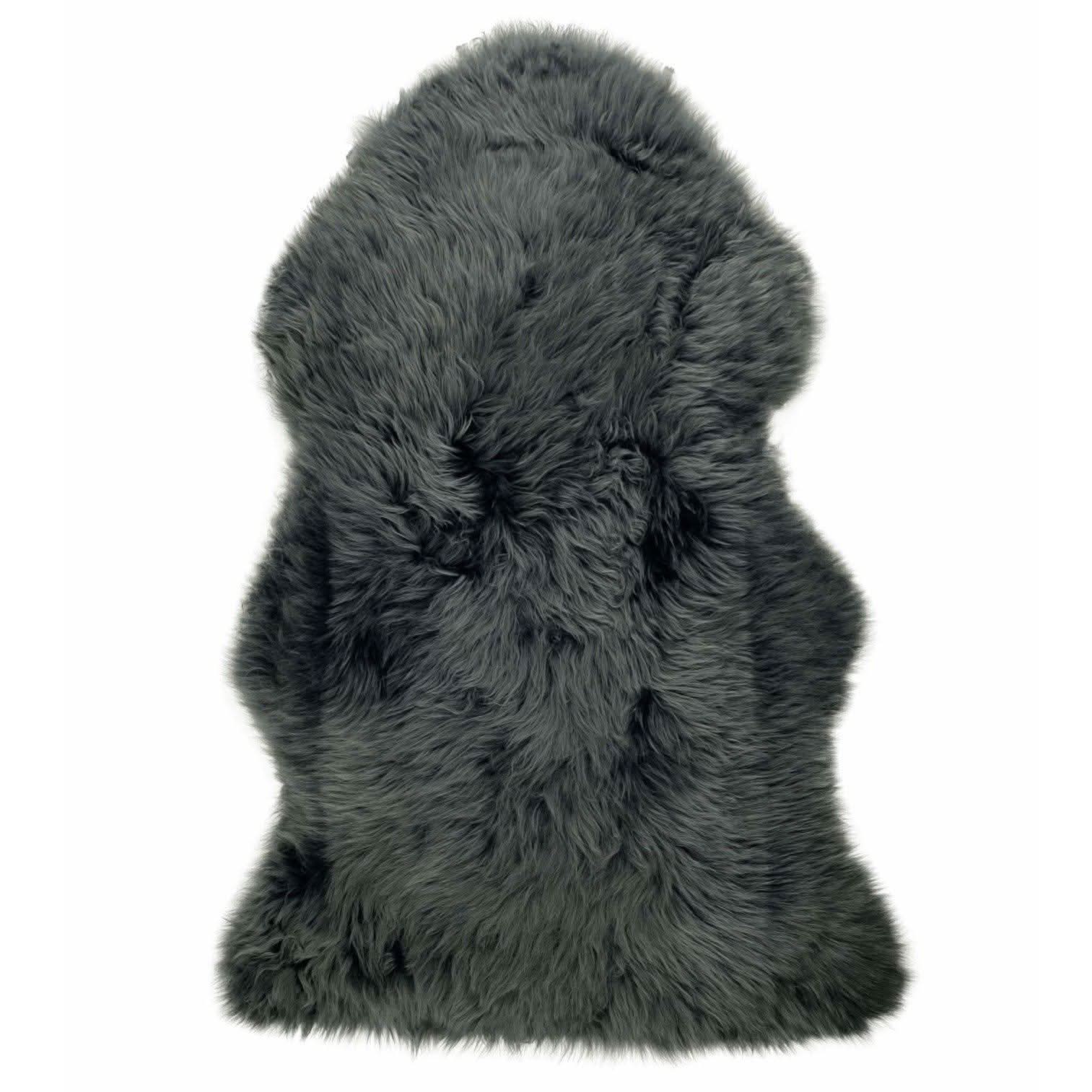 Grey sheepskin rug with thick wool pile viewed from above on white background. - Yellow Earth Australia